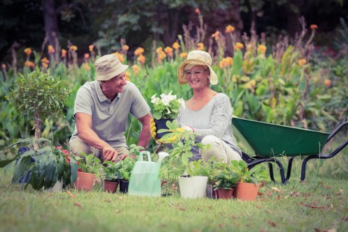 Team trimming hedges in a Raynes Park garden